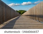 Bridge, clouds, trees reflection with blue sky in the Park in Canada