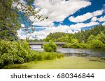 Bridge and cloudscape at Apple River in Amery, Wisconsin, USA.