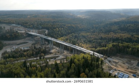 Bridge construction progressing over forest landscape. Clip - Powered by Shutterstock - Get 15% off with code: PIKWIZARD15