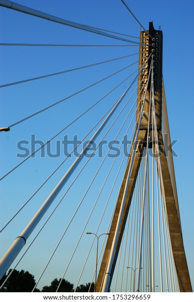 bridge construction of the bridge with pylons Warsaw\
cross lines blue sky
