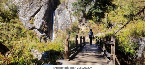 Bridge Crossing near Waterfall, Har Ki Doon Trail, Sankri Range, Uttarkashi, Uttarakhand, India - Shutterstock ID 2151207209