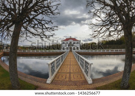 Bridge, house and two trees on the edges
