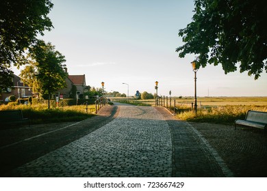 Bridge with lampposts at sunset