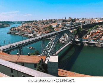 The Luís I Bridge in Lisbon is an iconic steel structure that spans the Tagus River, connecting the city to Almada, and is renowned for its stunning views, intricate design, and vibrant atmosphere, pa - Powered by Shutterstock