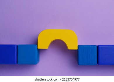 Bridge Made Of Colorful Blocks On Violet Background, Flat Lay. Connection, Relationships And Deal Concept