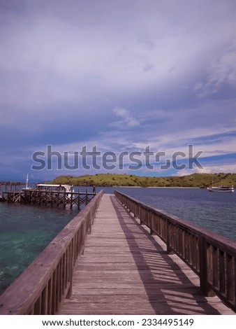 Bridge made of wood located on Pink beach, Labuan Bajo, Flores, East Nusa Tenggara, Indonesia