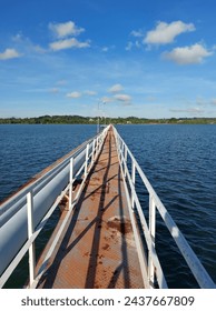 A bridge in middle of a ocean