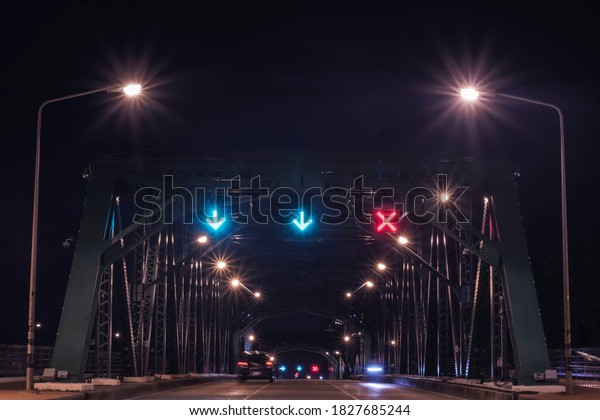 The Bridge in night time. The\
street in night time. Phra Phuttha Yodfa Bridge.\
Bangkok,Thailand