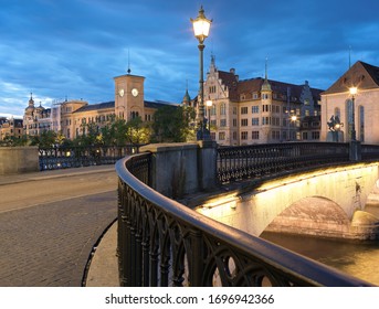 Münsterbrücke Bridge And Old Buildings Lit, Old Town Zurich Switzerland At Dusk