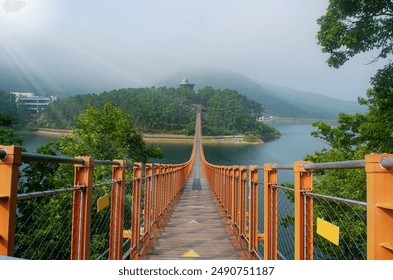 The bridge on the lake. the Majang Lake Suspension Bridge in Paju, Korea. - Powered by Shutterstock