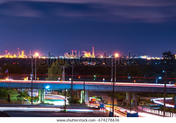 the bridge on the night and industrial\
background at rayong\
thailand