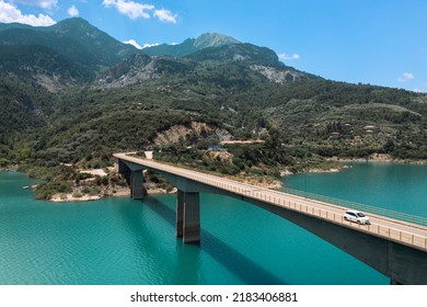 Bridge over blue lake with hills on background. Lake Kremaston and Episcopal Bridge, Central Greece. - Shutterstock ID 2183406881