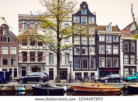 Similar – Schöne Architektur niederländischer Häuser und Hausboote am Amsterdamer Kanal im Herbst