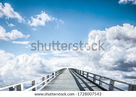 A bridge over the clouds leads to infinity
