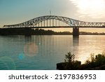 Bridge over Columbia River in Tri-Cities Washington in morning with sun flare