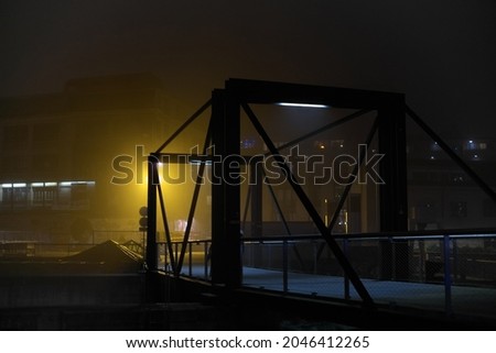 The bridge over the damn at Seujet on a foggy night in Geneva, Switzerland