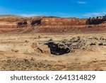  Bridge over the Dirty Devil River. Magnificent arch bridge over the Colorado River. Red-brown sandstone outcrops surround the river valley. Utah.