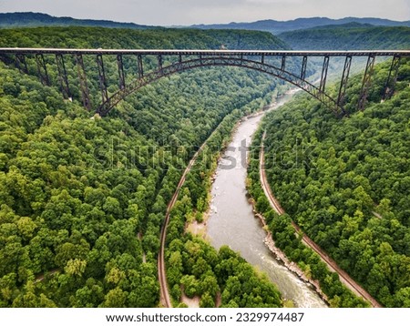 bridge over a gorge and river in New River Gorge National Park and Preserve in West Virginia. Taken from a bird's eye view.