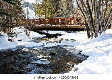 Bridge Over Icy River And Snowbank