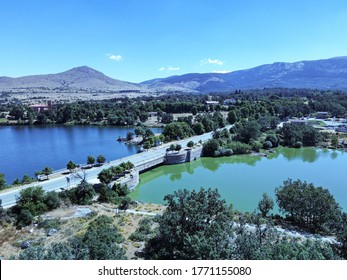 Bridge over the lake next to the Royal place of Saint Ildefonso, on the background the mountains between Madrid and Segovia￼. - Shutterstock ID 1771155080