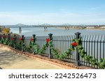 The Natchez–Vidalia Bridge over the Mississippi River seen from the the Natchez National Historical Park decorated for Christmas in Natchez,  Adams County, Mississippi, USA