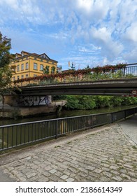 Bridge Over River Regnitz With Nice Flowers