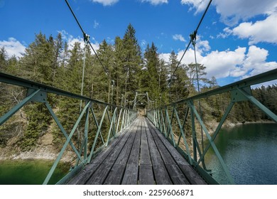 Bridge over wonderful lake in amazing mountain and forest scenery in austria. oetscherland near mariazell.  - Shutterstock ID 2259606871