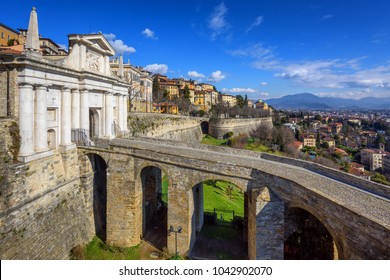 Bridge and Porta San Giacomo gate on the city walls of the Upper Old Town of Bergamo, Citta Alta, Italy