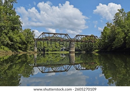 Bridge reflection on a summer day on the Caney River 