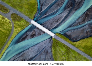 A bridge and road over Blue Glacier Water in Iceland Wide
