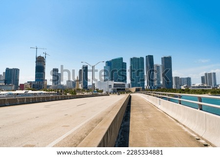 Bridge road over river on urban skyline