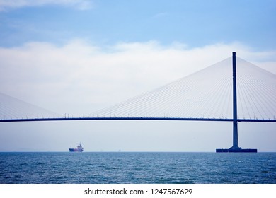 A bridge and a ship.