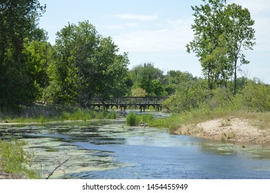 A bridge is a structure built to span a physical obstacle, such as a body of water, valley, or road, without closing the way underneath. It is constructed for the purpose of providing passage 