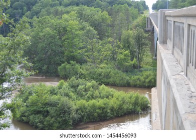 A bridge is a structure built to span a physical obstacle, such as a body of water, valley, or road, without closing the way underneath. It is constructed for the purpose of providing passage 