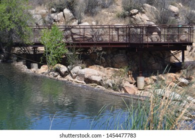 A bridge is a structure built to span a physical obstacle, such as a body of water, valley, or road, without closing the way underneath. 