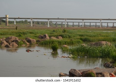 A bridge is a structure built to span a physical obstacle, such as a body of water, valley, or road, without closing the way underneath. The simplest type of a bridge is stepping stones.