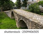 Tanner’s Bridge in Tirana, Albania. An arched stone 18th century Ottoman footbridge that would have crossed the Lana River at the time, but no longer does today. One of oldest structures in Tirana