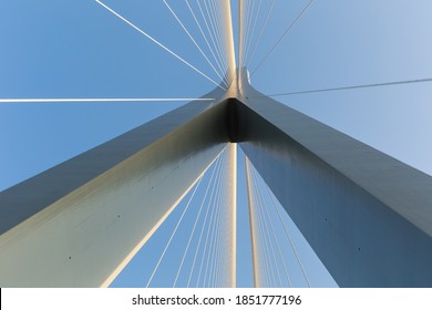 bridge tower with stay cables against a blue sky, abstract structure background
