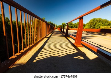 Bridge Vanishing Point With Red Railings