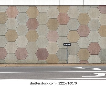 Bridge wall with texture and hexagon pattern with one way transit sign and road signs.  - Powered by Shutterstock - Get 15% off with code: PIKWIZARD15