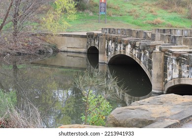 A Bridge And Water At The Confluence Park.