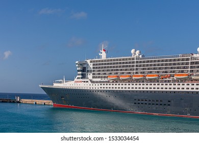 BRIDGETOWN, BARBADOS - December 2, 2017: RMS Queen Mary 2 Is The Largest Ocean Liner Ever Built, Having Served As The Flagship Of The Cunard Line Since Succeeding The Queen Elizabeth 2 In 2004.