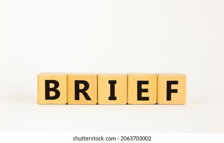 Brief symbol. The concept word 'brief' on wooden cubes on a beautiful white table, white background. Business and brief concept. Copy space. - Shutterstock ID 2063703002