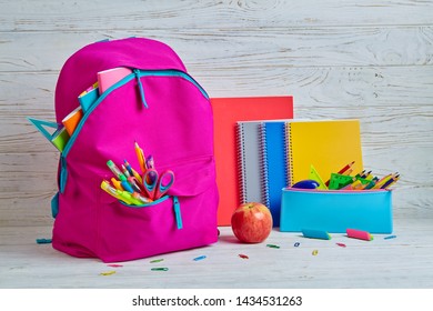 A Briefcase Next To Notebooks A Pencil Case, And An Apple On The Student's Desk. The Briefcase Is Ready For Returning To School