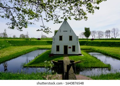 Brielle, The Netherlands - May 01 2018: The Kruithuis van Brielle is surrounded by a small canal on the Kruithuisbolwerk Bastion II