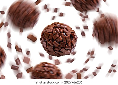 Brigadeiro, a traditional Brazilian candy made with chocolate with sprinkles spiral, on white background with space for text.