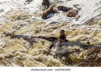 Brigadoon, Western Australia - Jun 28, 2014: Men in kayaks practise traversing the white water rapids at Bells Rapids, a popular tourist venue near Perth.