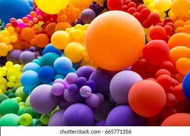 Bright abstract background of jumble of rainbow colored balloons celebrating gay pride - Powered by Shutterstock