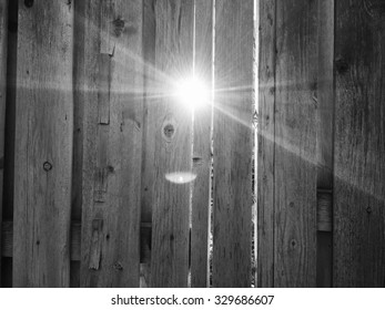 Bright Afternoon Light Shines Through The Slats And Wooden Fence On The First Day Of Spring In Salt Lake City, Utah