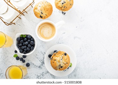 Bright And Airy Breakfast With Blueberry Muffin, Big Cup Of Coffee And Milk In Bottles Overhead View With Copyspace